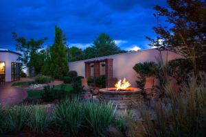 a fire pit in a yard next to a building at Courtyard Greensboro Airport in Greensboro