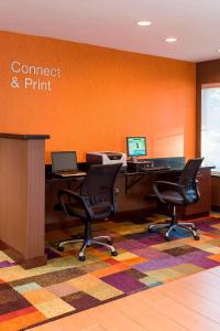 an office with a desk and two chairs and a computer at Fairfield Inn & Suites Naperville/Aurora in Naperville