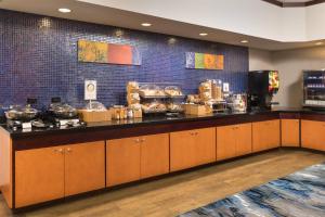a kitchen with a counter with food on it at Fairfield Inn & Suites Chattanooga I-24/Lookout Mountain in Chattanooga