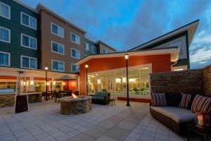 a patio with couches and a fire pit in front of a building at Residence Inn by Marriott Philadelphia Glen Mills/Concordville in Glen Mills