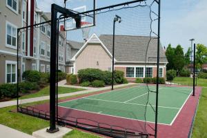 a tennis court in front of a house at Residence Inn Fort Wayne Southwest in Fort Wayne