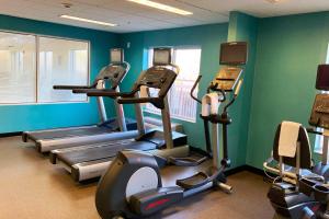 a gym with several tread machines in a room at Fairfield Inn by Marriott Denver / Westminster in Westminster