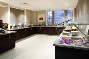 a large kitchen with a counter with food on it at Residence Inn by Marriott Atlanta Midtown/Georgia Tech in Atlanta