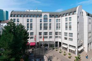 a large white building with a courtyard in front of it at Hamburg Marriott Hotel in Hamburg
