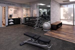 a fitness room with a gym with a bench and weights at Fairfield Inn and Suites by Marriott Bakersfield Central in Bakersfield