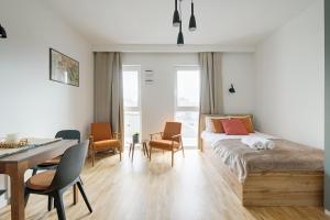 Posteľ alebo postele v izbe v ubytovaní Apartamenty Stadion Narodowy