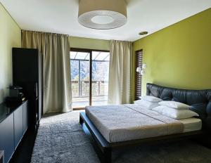 Posteľ alebo postele v izbe v ubytovaní VILLA COLLINA VERDE
