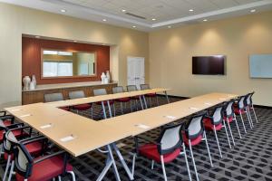 a conference room with a long table and chairs at TownePlace Suites by Marriott Columbus North - OSU in Columbus