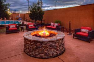 a fire pit in the middle of a patio at Courtyard by Marriott Alexandria in Alexandria