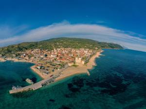 an aerial view of a small island in the ocean at Olga's appartments in Ouranoupoli