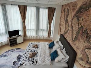 a bedroom with a bed with teddy bears on it at Apartmani Most in Mostar