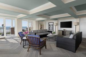 a living room with a couch and a tv at Marriott's Grande Ocean in Hilton Head Island
