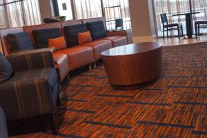a waiting room with couches and a table at Courtyard Aberdeen at Ripken Stadium in Aberdeen