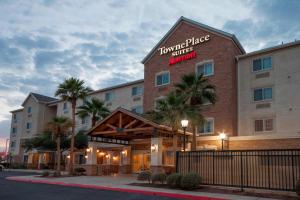 a hotel with a sign on the side of a building at TownePlace Suites El Centro in El Centro