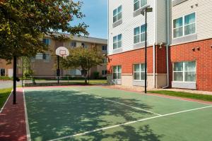 a basketball court in front of a building at TownePlace Suites by Marriott Chicago Naperville in Naperville