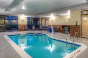a large swimming pool in a hotel room at Fairfield Inn & Suites by Marriott Canton in Canton