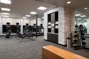 a gym with treadmills and machines in a room at Fairfield Inn & Suites by Marriott Canton in Canton