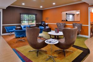 a waiting room with chairs and a table at Fairfield Inn & Suites Hattiesburg / University in Hattiesburg