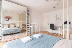 a bedroom with a bed and a desk in it at Modern Home in Central Berlin in Berlin