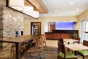a dining room with a large table and chairs at Fairfield Inn Kankakee Bourbonnais in Bourbonnais