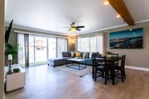 a living room with a couch and a table at Modern Beach Oasis in San Diego