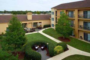 an aerial view of a building with a garden at Courtyard by Marriott Fayetteville in Fayetteville