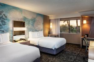 a hotel room with two beds and a window at Courtyard by Marriott Henderson - Green Valley - Las Vegas in Las Vegas