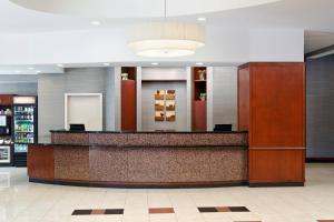 a hotel lobby with a reception counter and a pharmacy at Courtyard by Marriott Birmingham Downtown at UAB in Birmingham