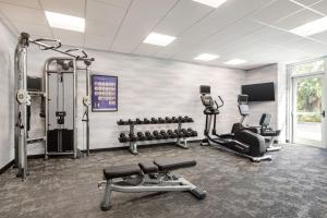 a gym with several exercise equipment in a room at Fairfield by Marriott Inn & Suites Bonita Springs in Bonita Springs