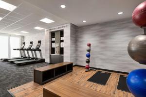 a fitness room with a gym with exercise equipment at Fairfield by Marriott Inn & Suites Bonita Springs in Bonita Springs