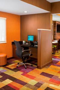 an office with a chair and a desk with a computer at Fairfield Inn & Suites Grand Rapids in Grand Rapids