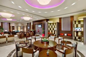a restaurant with tables and chairs in a room at Residence Inn by Marriott Jazan in Jazan