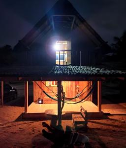 a house with a light on top of it at night at Nexpa cabañas Martha surf spot in Caleta de Campos