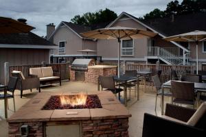 a patio with a fire pit and tables and chairs at Residence Inn by Marriott Atlanta Buckhead in Atlanta