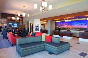 a lobby of a hotel with couches and a bar at Residence Inn by Marriott Los Angeles LAX/Century Boulevard in Los Angeles
