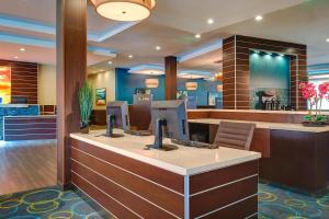 a lobby of a hotel with a reception desk at Fairfield Inn & Suites by Marriott San Diego Carlsbad in Carlsbad