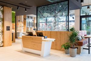 a lobby of a store with a reception desk at Residence Inn by Marriott Dortmund City in Dortmund