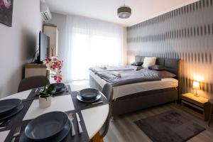 Voodi või voodid majutusasutuse Csipke Apartman toas