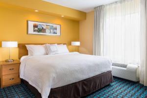 a hotel room with a large bed and a window at Fairfield Inn and Suites Valparaiso in Valparaiso