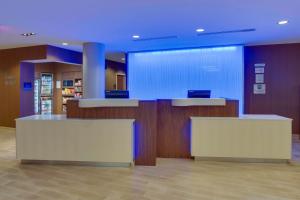 a lobby with two counters and a blue ceiling at Fairfield Inn & Suites By Marriott Fort Lauderdale Downtown/Las Olas in Fort Lauderdale