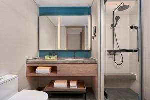 a bathroom with a sink and a mirror at Element Beijing Yanqing in Yanqing