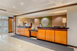 a lobby of a hotel with a reception desk at Fairfield Inn & Suites by Marriott Houston Conroe in Conroe