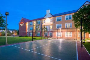 a basketball court in front of a building at Residence Inn Kansas City Olathe in Olathe