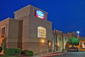 a building with a sign on top of it at Fairfield Inn & Suites Modesto in Modesto