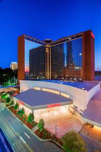 a large building with a basketball court in front of it at Little Rock Marriott in Little Rock