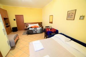Posteľ alebo postele v izbe v ubytovaní B&B Dimora dell' Etna