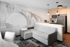 a living room with a couch in a kitchen at Residence Inn Richmond Midtown/Glenside in Richmond