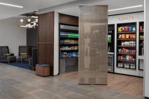 a lobby with a large pillar in the middle of a store at Courtyard by Marriott Houston I-10 West/Memorial in Houston