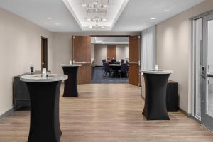 a conference room with two podiums and a table at Courtyard by Marriott Houston I-10 West/Memorial in Houston
