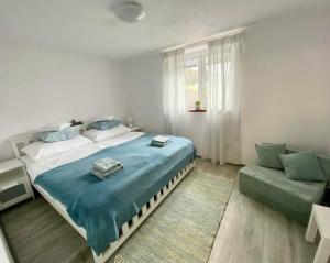 Posteľ alebo postele v izbe v ubytovaní Apartmán Eden